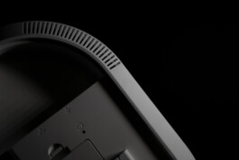 Close-up of Smart Vest Pro by Industrial Designer Simon Busse Studio for ABUS, showing vents and buttons on dark grey security device. 