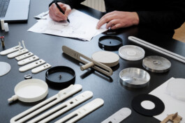 Cardboard and 3D-printed prototypes for the “Echo” table lamp by caussa, designed by Simon Busse.