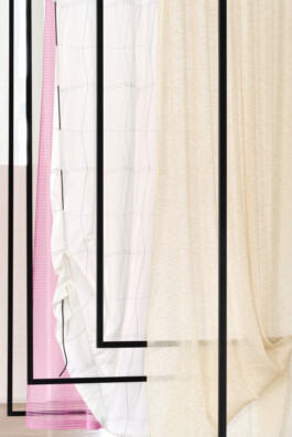 Simon Busse Studio portfolio: Three sheer curtains—pink, beige, and off-white—are suspended in black rectangular frames beside a white curtain featuring a grid pattern. The textiles overlap subtly, highlighting industrial-inspired framing and minimalistic spatial design characteristic of Simon Busse Studio.